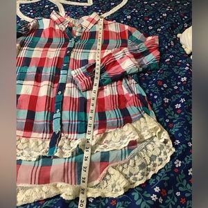 Woman size medium UMGEE long sleeve, button, down with collar  and lace trim top